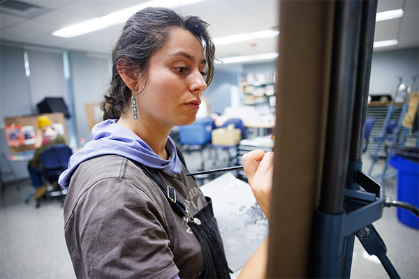 MCLA art student painting