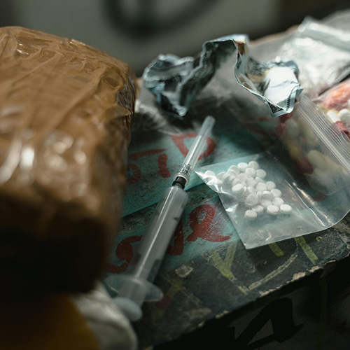 Male and female legs sitting across from each other