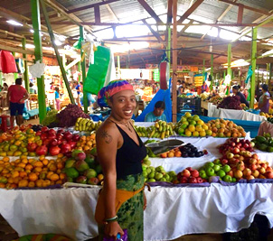 Student in a market in Ghana