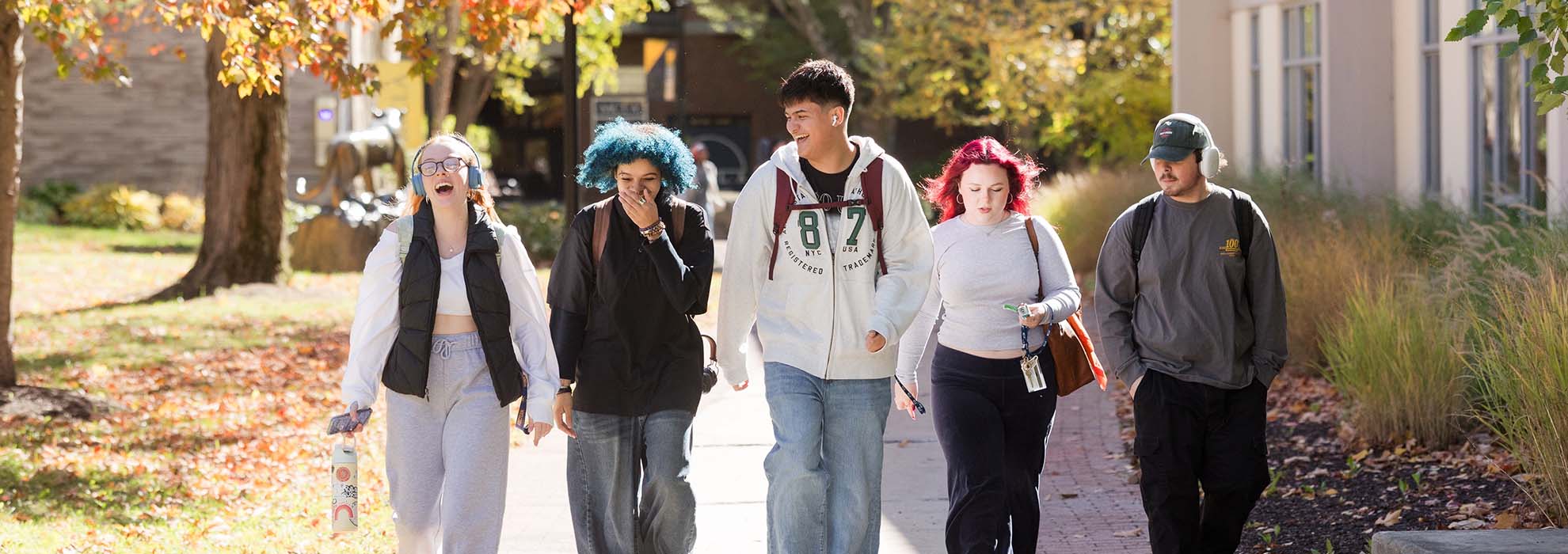 A group of MCLA students walking across campus.