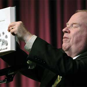 Michael Hingon holding up a book